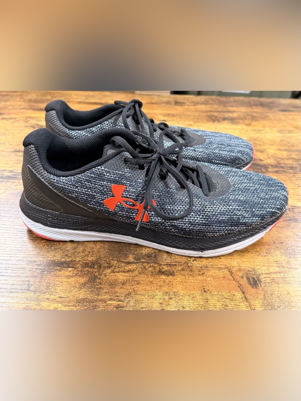 Under Armour Men’s Gray Knit Running Shoes with Orange Logo Accent